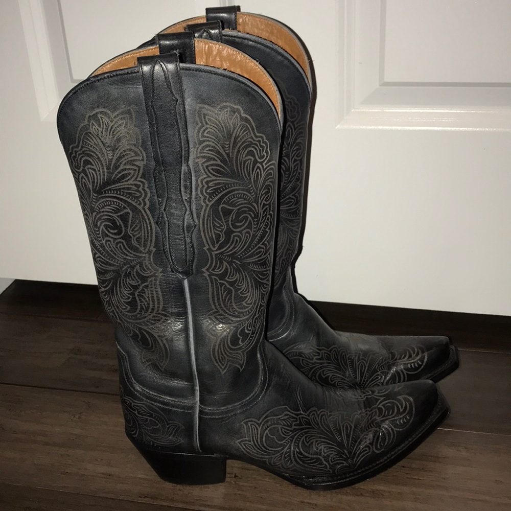 Black Lucchese etched cowboy boots.